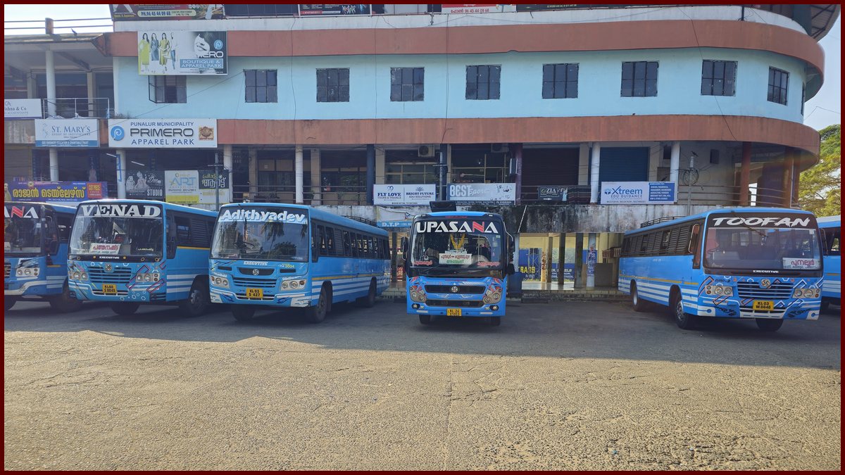 Blue private buses parked at the Punalur private bus stand in Kerala, from Wikimedia Commons (2025); not a photo from the talks